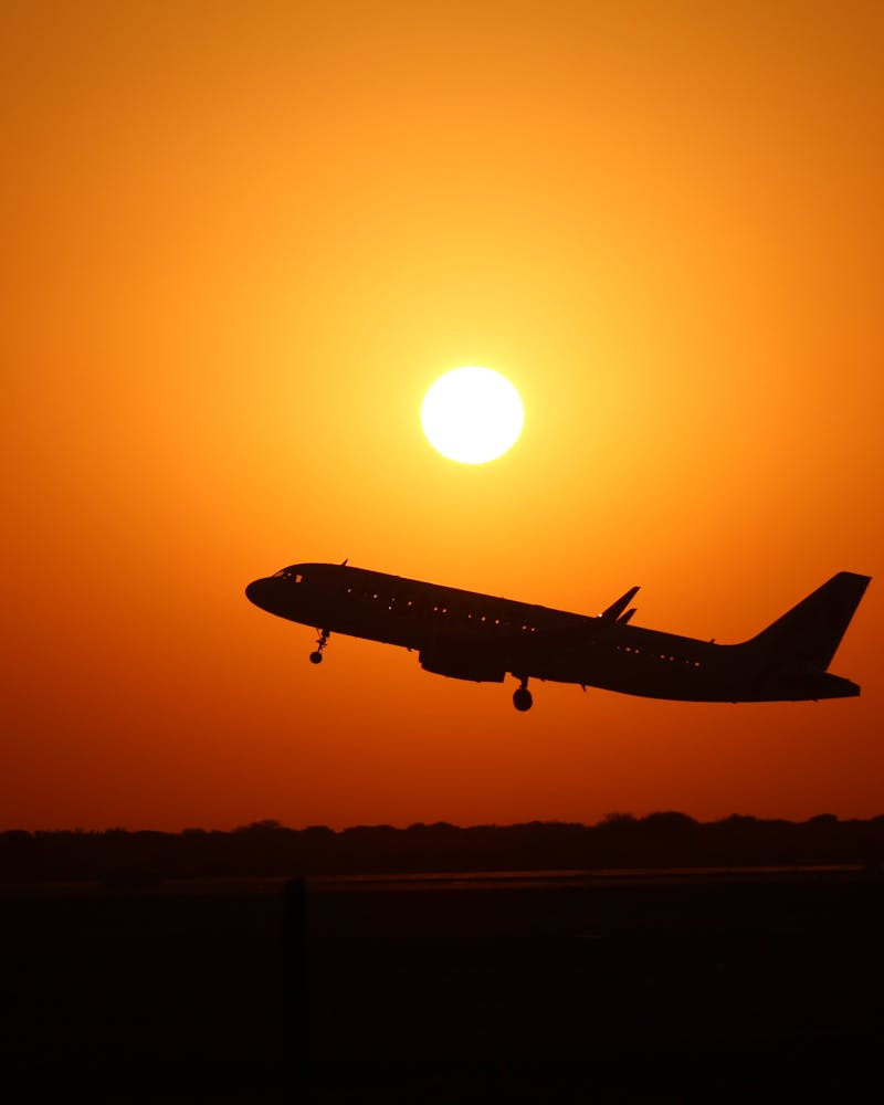 Aircraft silhouette at sunset