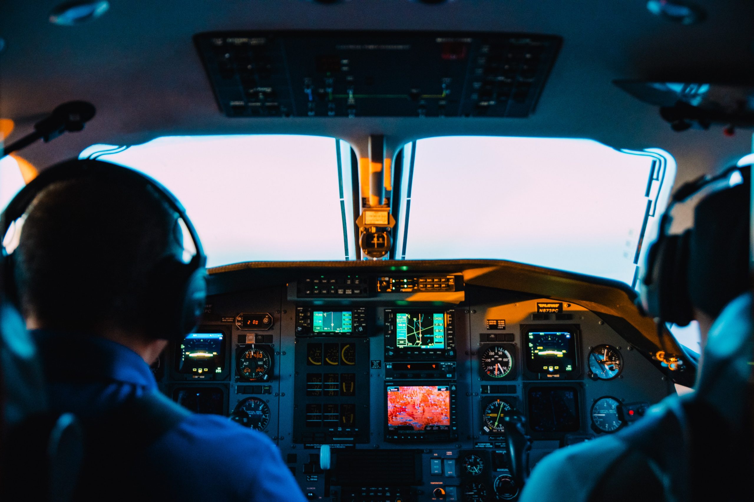 two people flying a plane