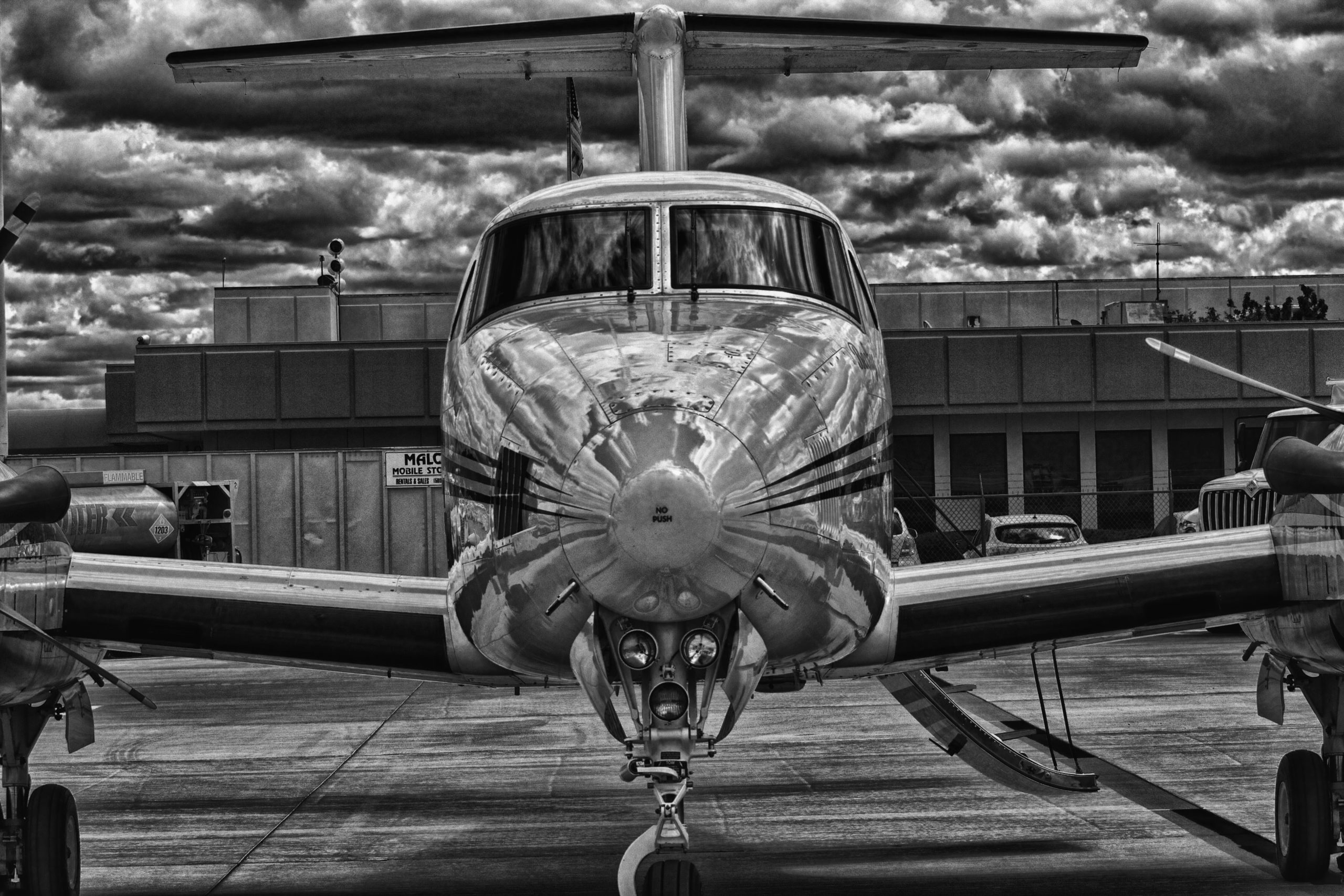 black and white photo of a private jet plane