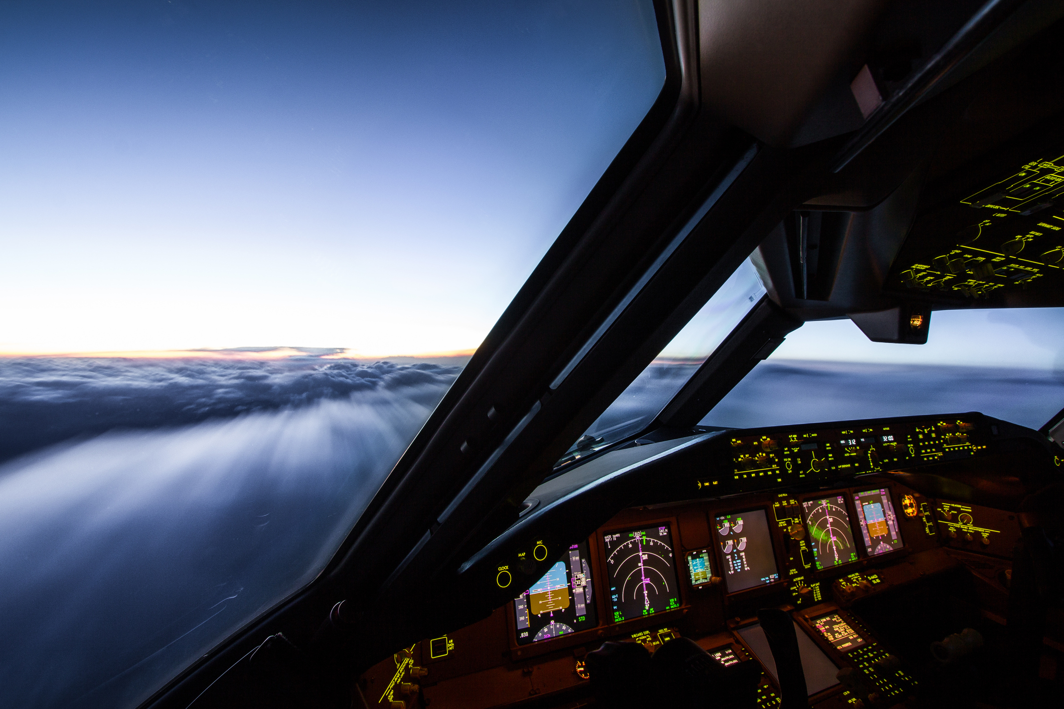 A private jet cockpit flying above the clouds in Texas with Lone Star Aviators.