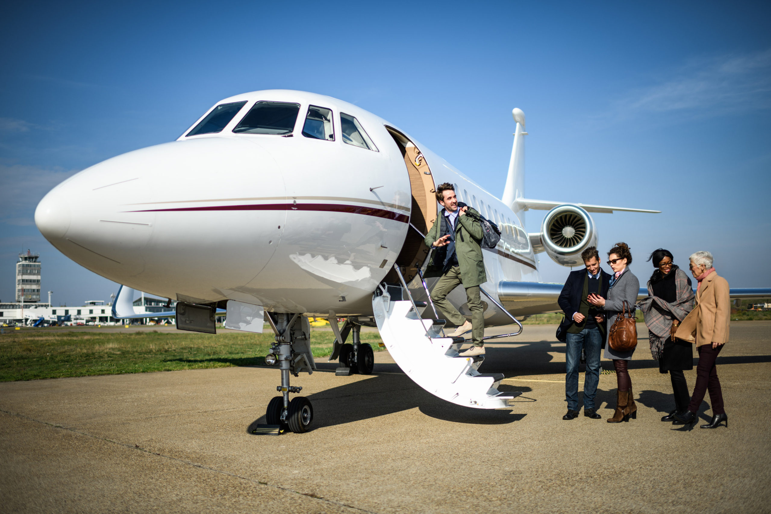 Friends board a private jet in Houston, Texas at Lone Star Aviators.